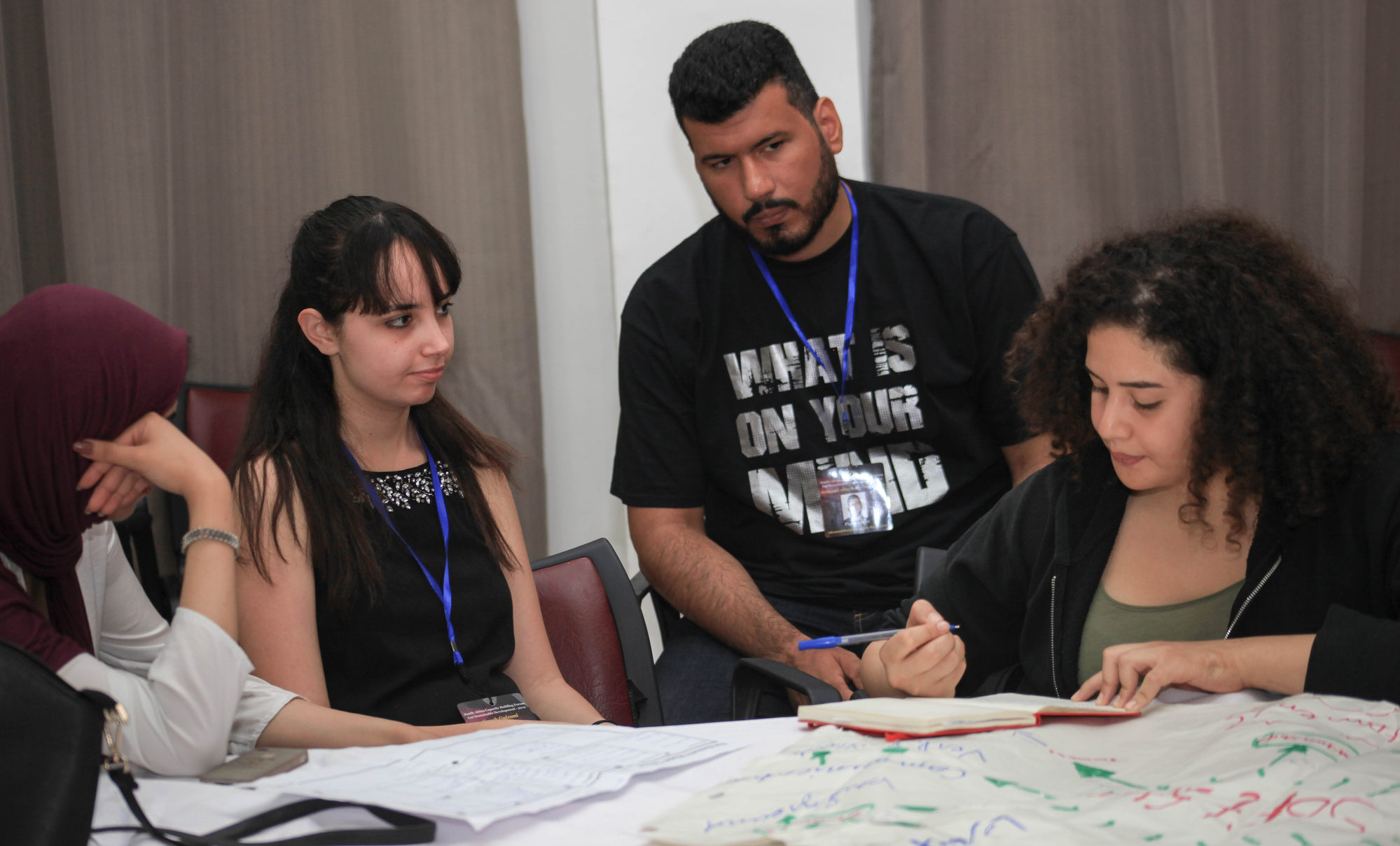 A small group working together on a flipchart