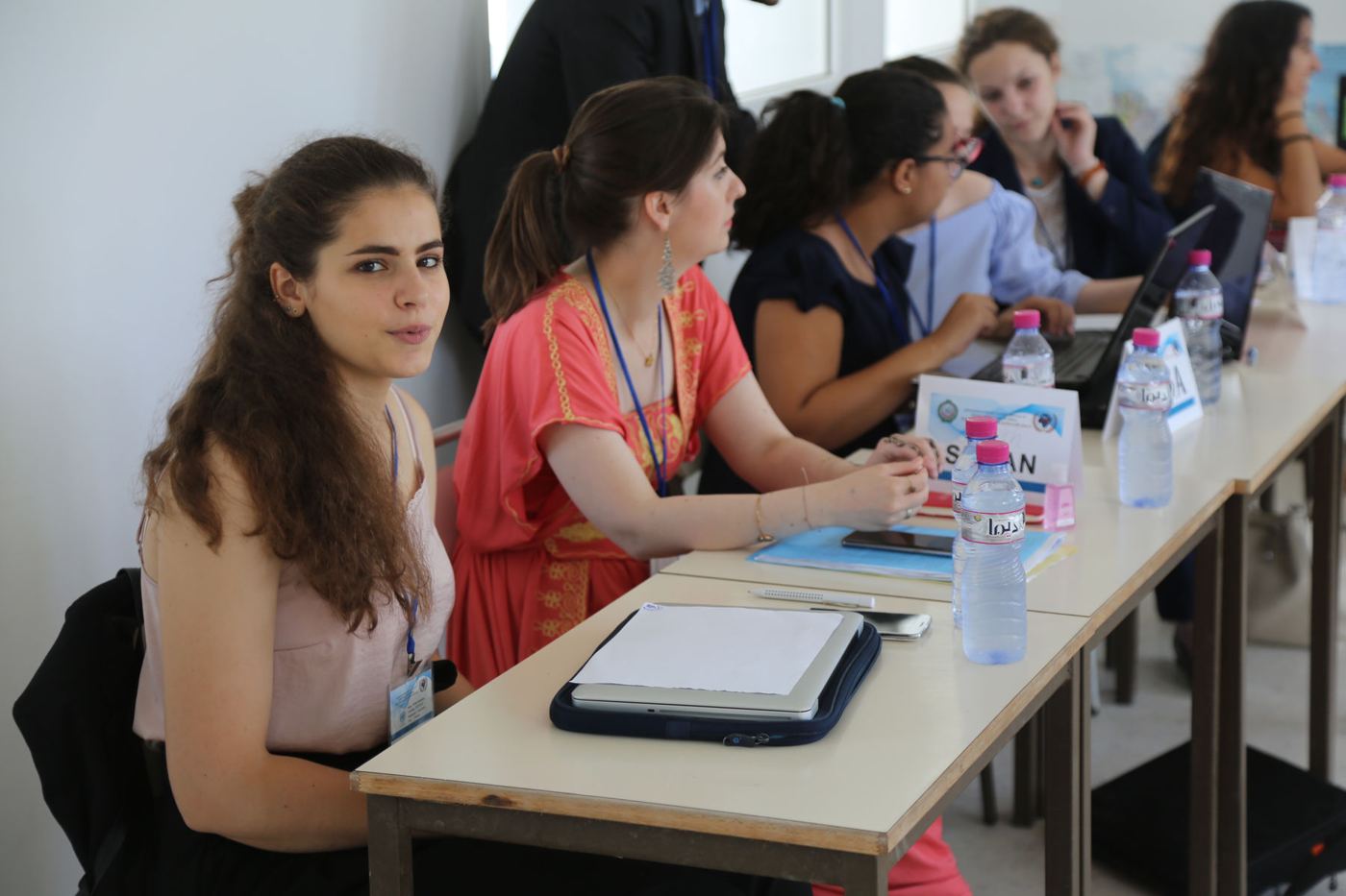 Delegates working at a committee table