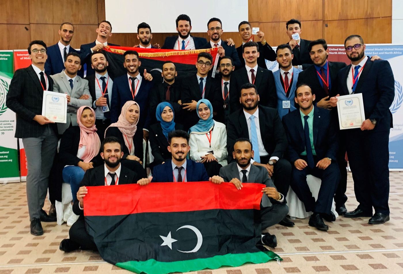 MENAMUN delegates posing together with their certificates